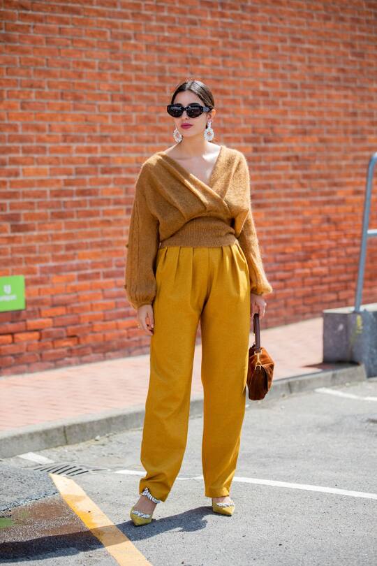 COPENHAGEN, DENMARK - AUGUST 08: Bettina Looney is seen wearing mustart v neck knit, pants outside By Malene Birger during Copenhagen Fashion Week Spring/Summer 2020 on August 08, 2019 in Copenhagen, Denmark. (Photo by Christian Vierig/Getty Images)