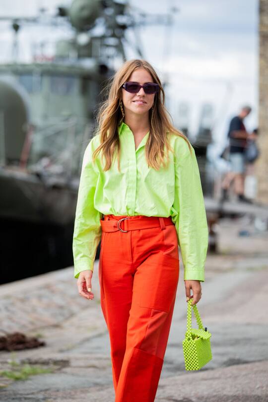 COPENHAGEN, DENMARK - AUGUST 08: Trine Kjaer seen wearing neon green button shirt, red pants outside Stine Goya during Copenhagen Fashion Week Spring/Summer 2020 on August 08, 2019 in Copenhagen, Denmark. (Photo by Christian Vierig/Getty Images)
