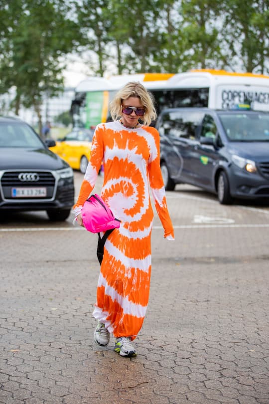 COPENHAGEN, DENMARK - AUGUST 10: A guest is seen wearing orange dress outside Gestuz on August 10, 2021 in Copenhagen, Denmark. (Photo by Christian Vierig/Getty Images)