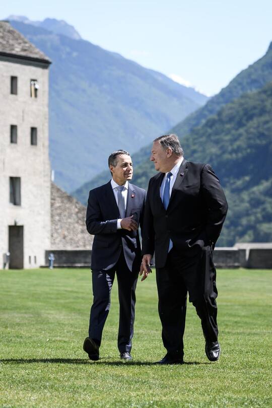 US Secretary of State Mike Pompeo (R) and Swiss counterpart Ignazio Cassis walk near the Castelgrande during a bilateral meeting on June 2, 2019 in Bellinzona, southern Switzerland. - The US top diplomat is on a European tour that will take him to Switzerland, the Netherlands and Britain. (Photo by Fabrice COFFRINI / AFP)
