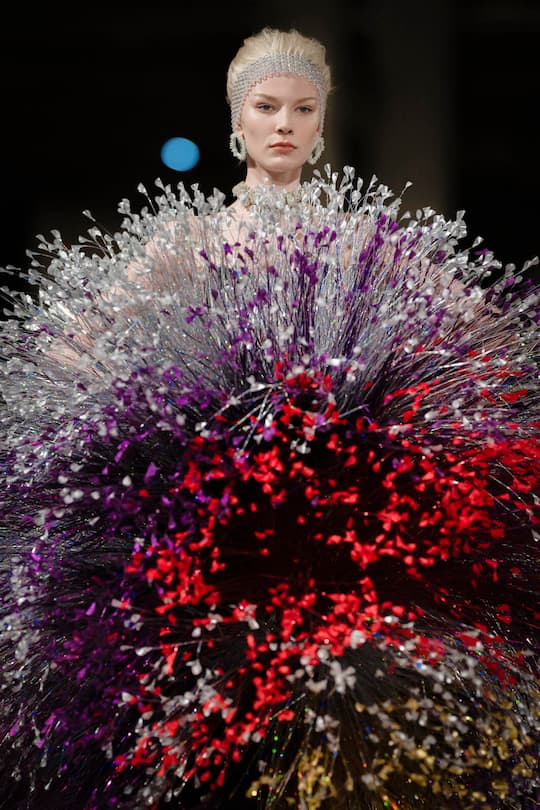 a model with a giant haute couture dress by kevin germanier