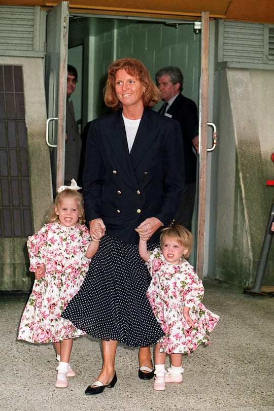 The Duchess of York and her daughters, Princess beatrice (L) and Princess Eugenie, at Heatthrow airport after returning from Jakarta. (Photo by Tim Ockenden - PA Images/PA Images via Getty Images)