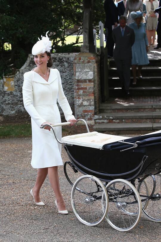 KING'S LYNN, ENGLAND - JULY 05: Catherine, Duchess of Cambridge pushes Princess Charlotte of Cambridge in her pram they leave the Church of St Mary Magdalene on the Sandringham Estate for the Christening of Princess Charlotte of Cambridge on July 5, 2015 in King's Lynn, England. (Photo by Chris Jackson/Getty Images)