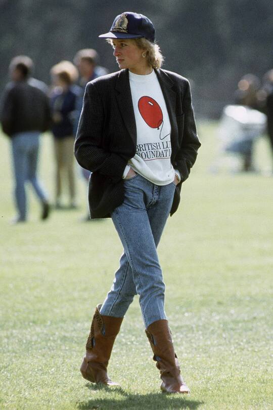 WINDSOR, UNITED KINGDOM - MAY 02: Diana, Princess Of Wales At Guards Polo Club. The Princess Is Casually Dressed In A Sweatshirt With The British Lung Foundation Logo On The Front, Jeans, Boots And A Baseball Cap. (Photo by Tim Graham Photo Library via Getty Images)