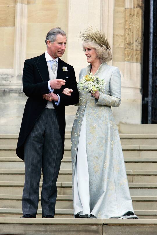 WINDSOR, ENGLAND - APRIL 9: TRH the Prince of Wales, Prince Charles, and The Duchess Of Cornwall, Camilla Parker-Bowles in silk dress by Robinson Valentine and head-dress by Philip Treacy, leave the Service of Prayer and Dedication blessing their marriage at Windsor Castle on April 9, 2005 in Berkshire, England. (Photo by Tim Graham Photo Library via Getty Images)