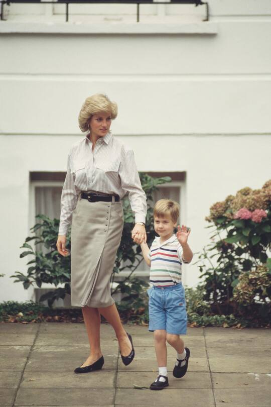 Diana, Princess of Wales (1961 - 1997) with her son Prince William on his brother Prince Harry's first day at Mrs Mynors' nursery school in London, September 1987. (Photo by Jayne Fincher/Princess Diana Archive/Getty Images)