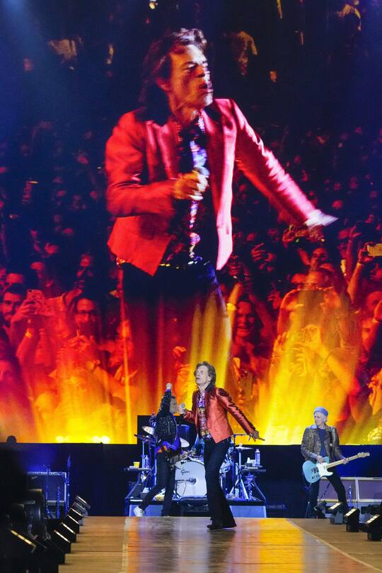 Mick Jagger, displayed on screen and centre, Ronnie Wood, left, and Keith Richards, right, of the band the Rolling Stones, perform during their Sixty Stones Europe 2022 tour at the Wanda Metropolitano stadium in Madrid, Spain, Wednesday, June 1, 2022. (AP Photo/Manu Fernandez) Ronnie Wood,Mick Jagger,Keith Richards