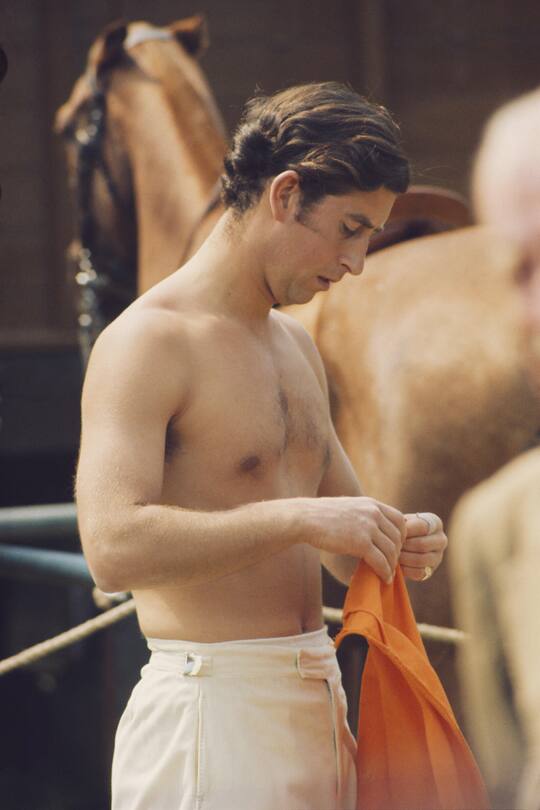 Charles, Prince of Wales changing during a polo match, circa 1975. (Photo by Serge Lemoine/Hulton Archive/Getty Images)