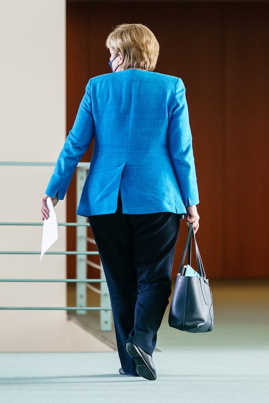 BERLIN, GERMANY - AUGUST 10: German Chancellor Angela Merkel leaves after a press conference after a virtual meeting with German state leaders about the current coronavirus situation, at the Chancellery on August 10, 2021 in Berlin, Germany. (Photo by Clemens Bilan-Pool/Getty Images)