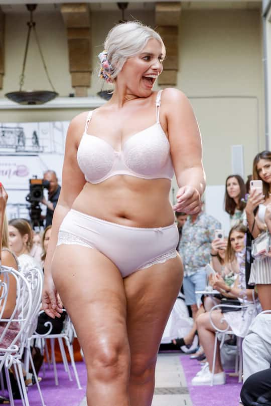 BERLIN, GERMANY - JULY 01: Plus size model Angelina Kirsch walks the runway at the Lascana fashion show at Titanic Hotel on July 1, 2019 in Berlin, Germany. (Photo by Isa Foltin/Getty Images for Lascana)
