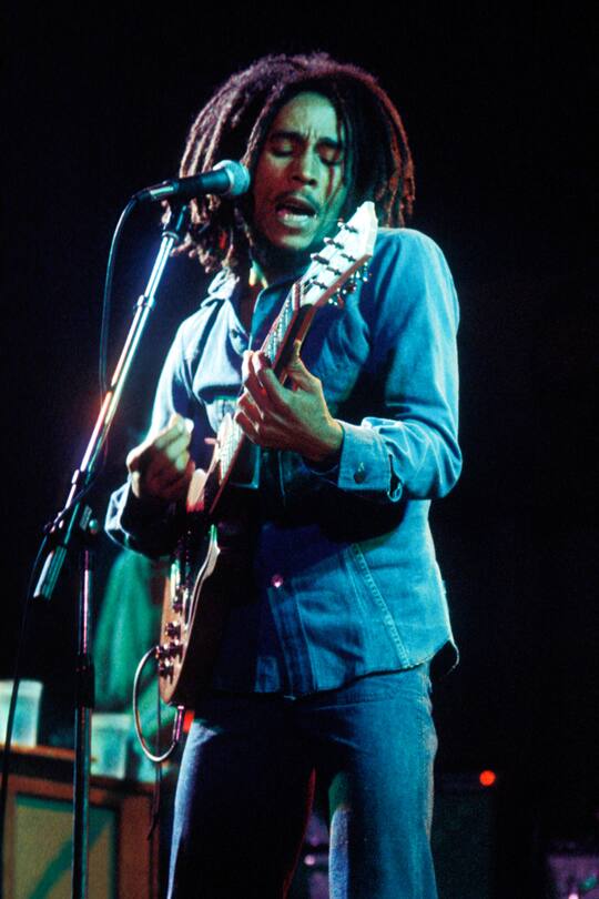 Bob Marley and The Wailers perform on stage at the Odeon, Birmingham, United Kingdom, 18 July 1975. (Photo by Ian Dickson/Redferns)