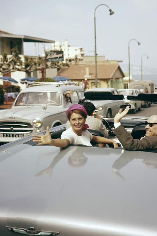 Italian actress Sophia Loren in a car with her husband, the Italian producer Carlo Ponti. (Photo by Pierluigi Praturlon/Reporters Associati & Archivi/Mondadori Portfolio via Getty Images)