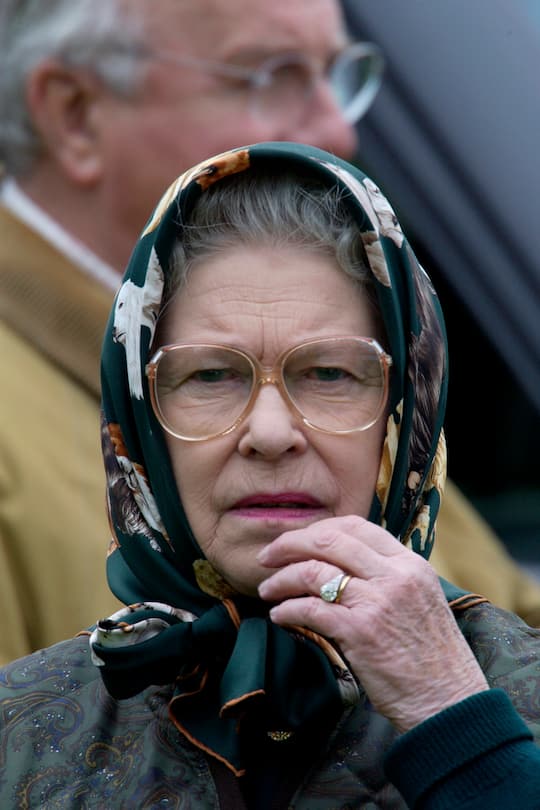 WINDSOR, UNITED KINGDOM - MAY 18: Queen Elizabeth Ll In Casual Clothes, Headscarf And Spectacles, Looking Anxious While Watching Her Husband Competing In The Cross Country Section Of The International Carriage Driving Grand Prix Championships At The Royal Windsor Horse Show. (Photo by Tim Graham Photo Library via Getty Images)