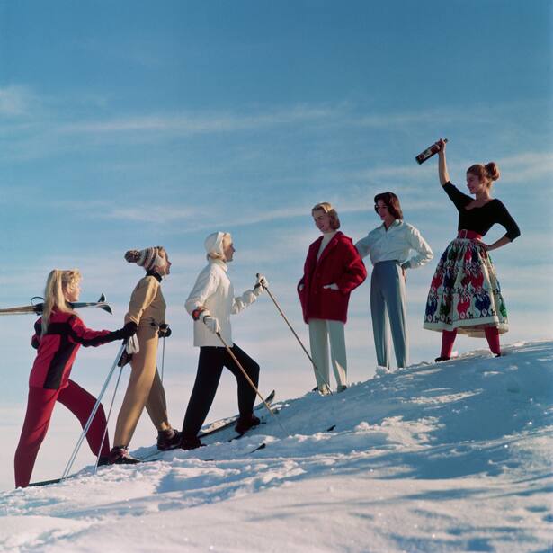 A group of ladies welcome their friends back from a day's skiing, with an apres ski drink. (Photo by Chaloner Woods/Getty Images)