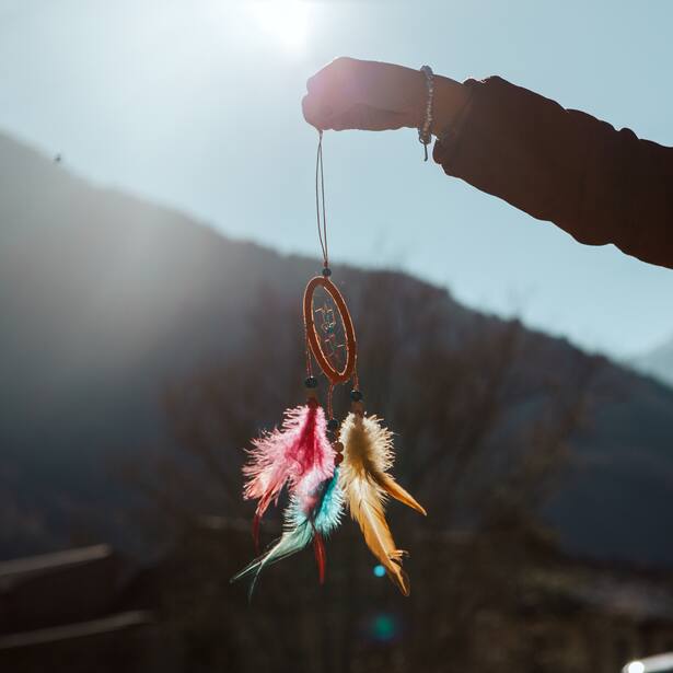 hand holding a dreamcatcher