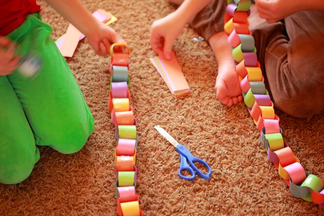 Children Assembling Homemade Holiday Paper Chains