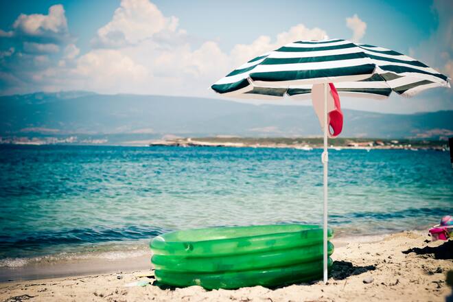 A beach umbrella and some games for kids.