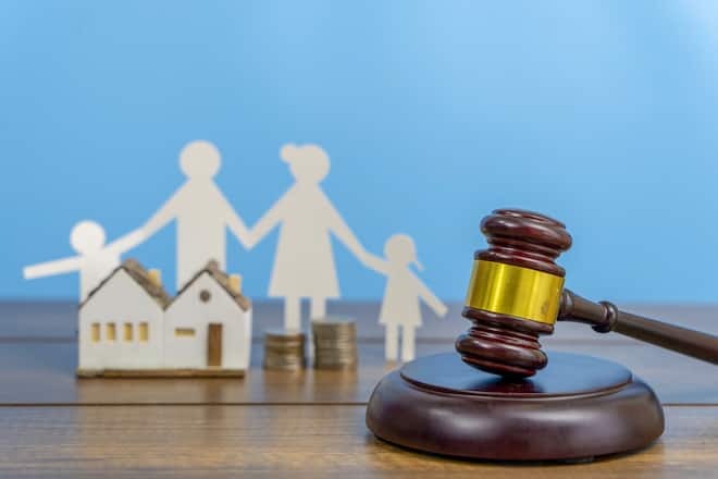 Family figure and gavel on table. Family law concept