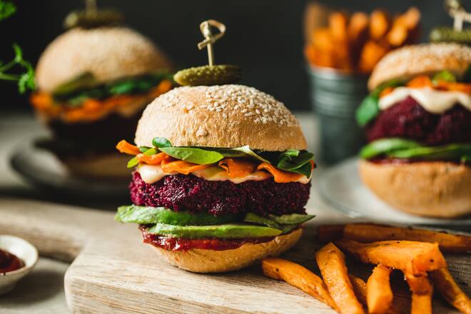 Cropped image of three vegan burgers representing the quality of vegan food