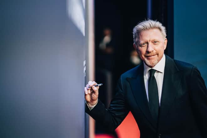 MONACO, MONACO - FEBRUARY 18: (EDITORS NOTE: Image was altered with digital filters.) Laureus Academy Member Boris Becker signs the Nelson Mandela Wall during the 2019 Laureus World Sports Awards at the Salle des Etoiles, Sporting Monte-Carlo on February 18, 2019 in Monaco, Monaco. (Photo by Simon Hofmann/Getty Images for Laureus)