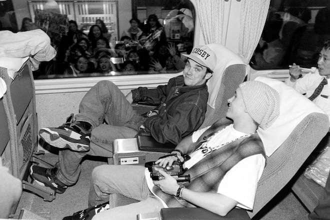 Mark Owen and Robbie Williams of Take That on the Bullet train in Tokyo, March 1993 (Photo by Dave Hogan/Getty Images)