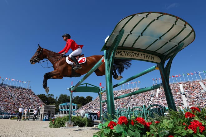 VERSAILLES, FRANCE - AUGUST 06: Steve Guerdat and horse Dynamix De Belheme of Team Switerland compete in the Jumping Individual Final on day eleven of the Olympic Games Paris 2024 at Chateau de Versailles on August 06, 2024 in Versailles, France. (Photo by Alex Broadway/Getty Images)