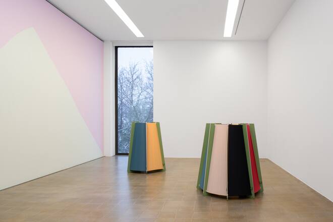 exhibition space with two colourful objects