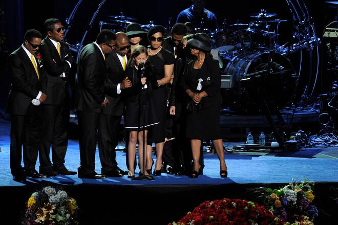 LOS ANGELES, CA - JULY 07: Michael Jackson's daughter Paris Jackson (C) is supported by family members after speaking at the Michael Jackson public memorial service held at Staples Center on July 7, 2009 in Los Angeles, California. Jackson, the iconic pop star, died at the age of 50 at UCLA Medical Center after going into cardiac arrest at his rented home on June 25 in Los Angeles. (Photo by Paul Buck-Pool/Getty Images)
