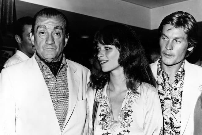 Luchino Visconti, Charlotte Rampling, Helmut Berger arrive at Warner Brothers Film Festival in Freeport, Grand Bahama Island, 1969