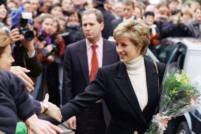 LONDON, UNITED KINGDOM - JANUARY 13: Diana, Princess Of Wales, Patron Of The Charity "centrepoint", Shaking Hands With Members Of The Crowd Outside T Centrepoint's New Hostel For The Homeless In Leicester Square, London. The Princess Is Wearing A Cream Polo Neck Jumper With A Black Blazer. (Photo by Tim Graham Photo Library via Getty Images)