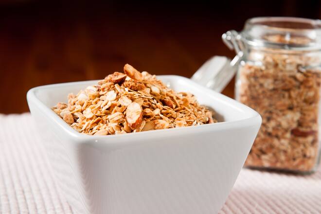 A bowl of Honey Almond Granola with Shredded Coconut.
