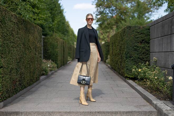 COPENHAGEN, DENMARK - AUGUST 06: A guest is seen on the street during Copenhagen Fashion Week SS20 wearing black blazer and top, taupe skirt and shoes, black bag on August 06, 2019 in Copenhagen, Denmark. (Photo by Matthew Sperzel/Getty Images)