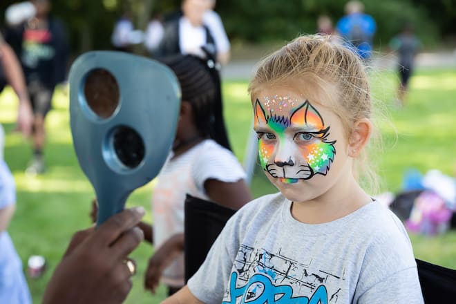 LONDON, ENGLAND - AUGUST 14: A young girl gets her face painted while attending the Thamesmead Festival, a one day festival of music, art, craft and business on August 14, 2021 in London, England. (Photo by Tim P. Whitby/Getty Images for Thamesmead)