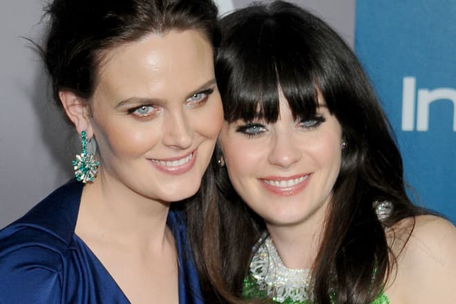 BEVERLY HILLS, CA - JANUARY 15: Actors Emily Deschanel and Zooey Deschanel arrive at 13th Annual Warner Bros. And InStyle Golden Globe After Party at The Beverly Hilton hotel on January 15, 2012 in Beverly Hills, California.