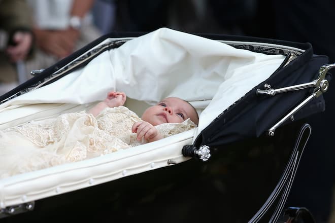 KING'S LYNN, ENGLAND - JULY 05: Princess Charlotte of Cambridge is pushed in her silver cross pram as she leavesthe Church of St Mary Magdalene on the Sandringham Estate for the Christening of Princess Charlotte of Cambridge on July 5, 2015 in King's Lynn, England. (Photo by Chris Jackson - WPA Pool / Getty Images)
