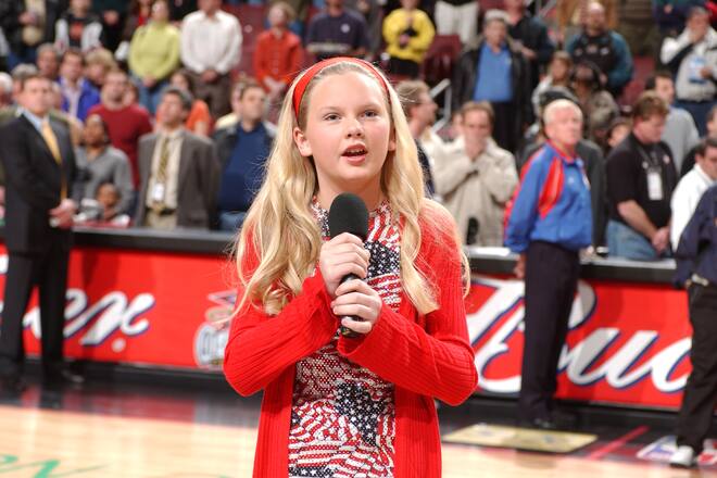 PHILADELPHIA, PA - APRIL 5: Performer Taylor Swift sings the National Anthem prior to the game of the Detroit Pistons against the Philadelphia 76ers on April 5, 2002 at the Comcast Center in Philadelphia, Pennsylvania. NOTE TO USER: User expressly acknowledges and agrees that, by downloading and/or using this Photograph, user is consenting to the terms and conditions of the Getty Images License Agreement. Mandatory Copyright Notice: Copyright 2014 NBAE (Photo by Jesse D. Garrabrant/NBAE via Getty Images)