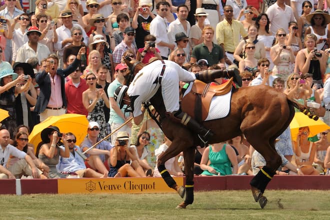 NEW YORK - JUNE 27: HRH Prince Harry falls off his horse during the 3rd annual Veuve Clicquot Polo Classic on Governors Island on June 27, 2010 in New York City. (Photo by Stephen Lovekin/Pool/Getty Images)