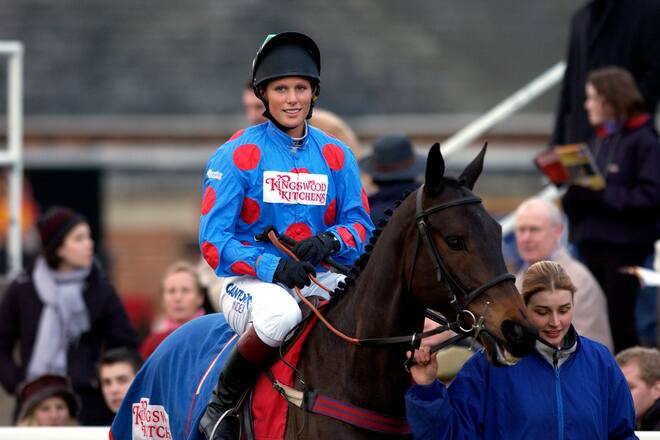 NEWBURY, UNITED KINGDOM - FEBRUARY 14: Zara Phillips At Newbury Racecourse Competing As A Jockey In The Queen Mother Memorial Fund Charity Flat Race On Behalf Of The British Red Cross Charity. Wearing The Logo Of Sponsors Kingswood Kitchens She Is Led Around The Parade Ring On A Horse Called Mrs Phillip. (Photo by Tim Graham Photo Library via Getty Images)