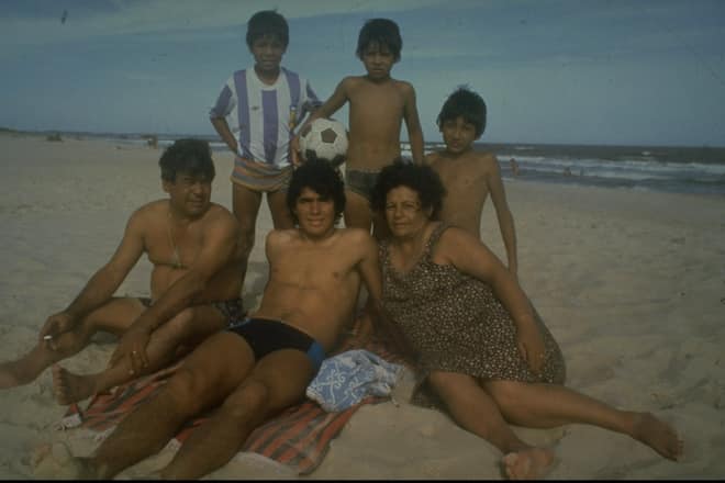 1970: A young Diego Maradona (centre) of Argentina relaxing with his family on a beach. \ Mandatory Credit: Allsport UK /Allsport