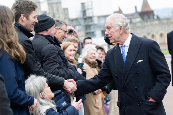 WINDSOR, ENGLAND - MARCH 31: King Charles III and Queen Camilla meet well wishers as they leave the Easter Service at Windsor Castle on March 31, 2024 in Windsor, England. (Photo by Samir Hussein/WireImage)