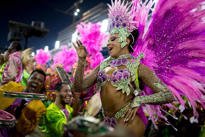 RIO DE JANEIRO, BRAZIL - MARCH 02: Queen of Percussion Evelyn Bastos of Mangueira celebrates during their parade at 2014 Brazilian Carnival at Sapucai Sambadrome on March 02, 2014 in Rio de Janeiro, Brazil. Rio's two nights of Carnival parades begin on March 2 in a burst of fireworks and to the cheers of thousands of tourists and locals who have previously enjoyed street celebrations (known as "blocos de rua") all around the city. (Photo by Buda Mendes/Getty Images)