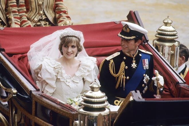 LONDON - JULY 29: Diana, Princess of Wales and Prince Charles ride in a carriage after their wedding at St. Paul's Cathedral July 29, 1981 in London, England. (Photo by Anwar Hussein/WireImage)