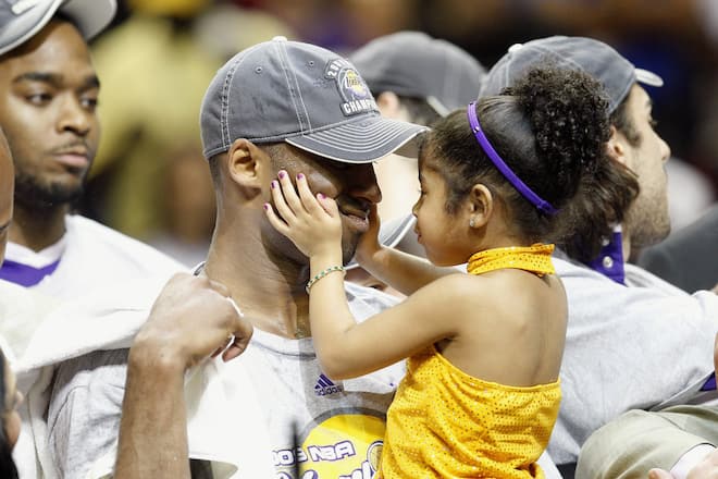 ORLANDO, FL - JUNE 14: Kobe Bryant #24 of the Los Angeles Lakers holds his daughter, Gianna, after the Lakers defeated the Orlando Magic in Game Five of the 2009 NBA Finals on June 14, 2009 at Amway Arena in Orlando, Florida. The Lakers won 99-86. NOTE TO USER: User expressly acknowledges and agrees that, by downloading and or using this photograph, User is consenting to the terms and conditions of the Getty Images License Agreement. (Photo by Ronald Martinez/Getty Images)