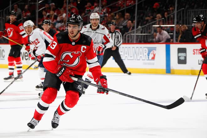 NEWARK, NEW JERSEY - OCTOBER 04: Nico Hischier #13 of the New Jersey Devils skates against the Washington Capitals in a preseason game at the Prudential Center on October 04, 2021 in Newark, New Jersey. (Photo by Bruce Bennett/Getty Images)