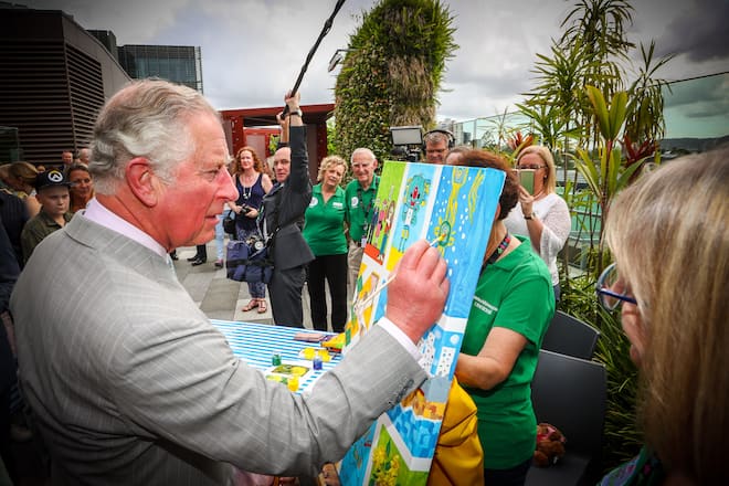BRISBANE, AUSTRALIA - APRIL 04: Prince Charles, Prince of Wales adds his finishing touch to a children's painting during his official visit to the Lady Cilento Children's Hospital on April 4, 2018, Brisbane, Australia. The Prince of Wales and Duchess of Cornwall are on a seven-day tour of Australia, visiting Queensland and the Northern Territory. (Photo by Patrick Hamilton - Pool/Getty Images)