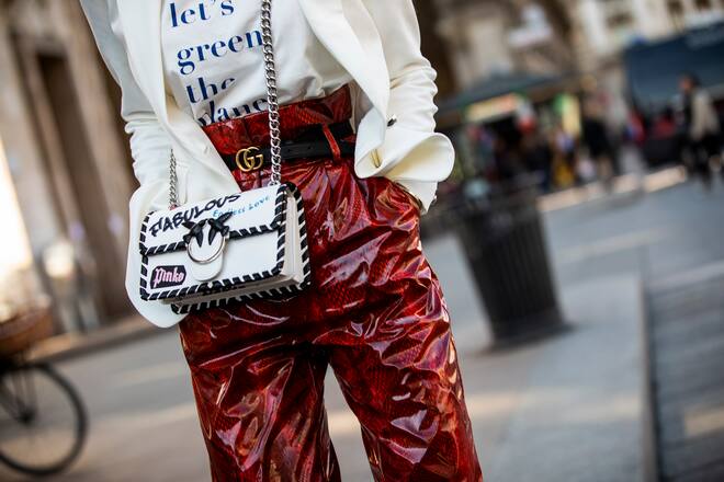 MILAN, ITALY - FEBRUARY 24: Mary Leest, wearing white jacket, Gucci belt, red snake print pants and Pinko bag, is seen outside Stella Jean on Day 5 Milan Fashion Week Autumn/Winter 2019/20 on February 24, 2019 in Milan, Italy. (Photo by Claudio Lavenia/Getty Images)