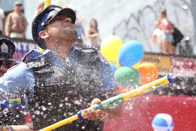 TORONTO, ON- JUNE 29 - A Toronto Police Officer sprays and gets sprayed during the WorldPride 2014 parade hosted by Pride Toronto along Yonge Street in Toronto. June 29, 2014. (Steve Russell/Toronto Star via Getty Images)