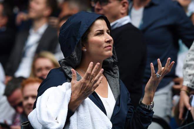 MELBOURNE, AUSTRALIA - JANUARY 20: Mirka Federer, wife of Roger Federer puts on her rain jacket on Rod Laver Arena during a rain delay on day one of the 2020 Australian Open at Melbourne Park on January 20, 2020 in Melbourne, Australia. (Photo by James D. Morgan/Getty Images)