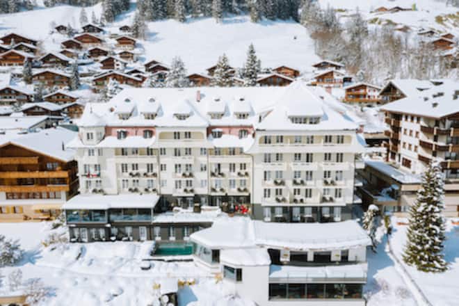 an old hotel in a snowy mountain resort