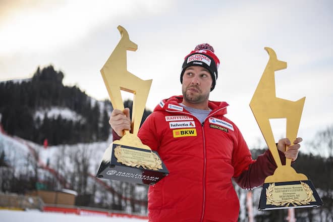 epa08962491 Beat Feuz of Switzerland poses for photographs with his Gams trophies after winning the two men's Downhill races of the FIS Alpine Skiing World Cup event in Kitzbuehel, Austria, 24 January 2021. EPA/CHRISTIAN BRUNA